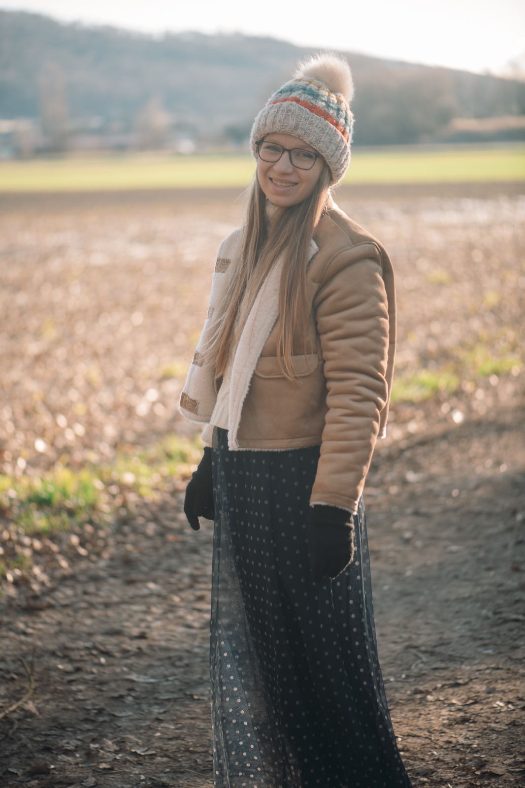 a woman sitting on a rock